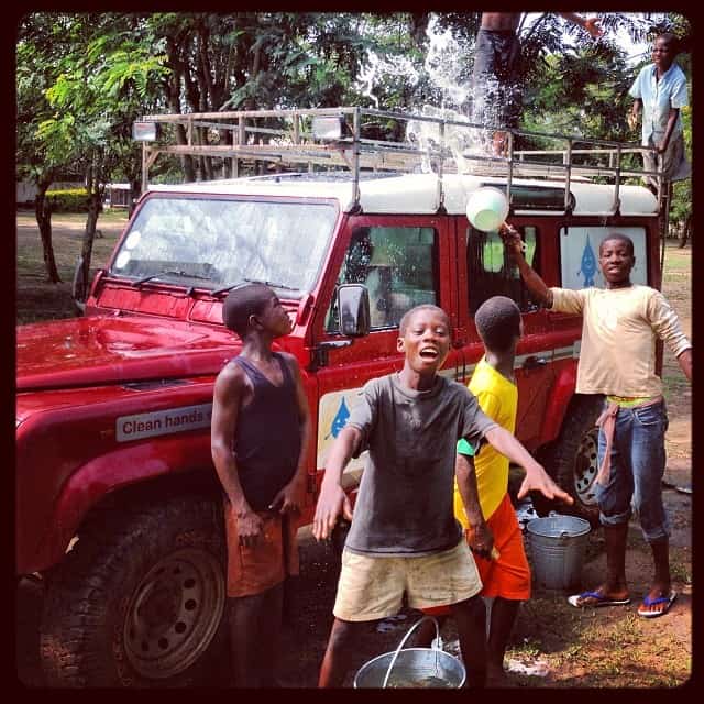 How many African children does it take to wash a Land Rover?