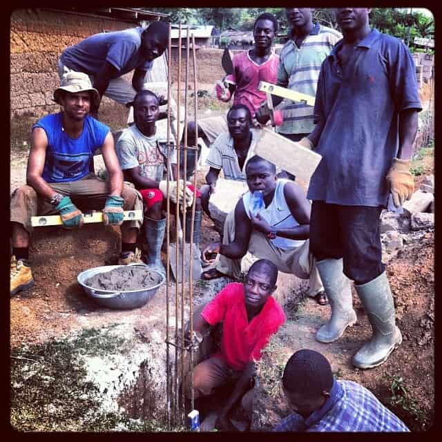 Peter, our Head Builder in Abenta lays the first block of the school.