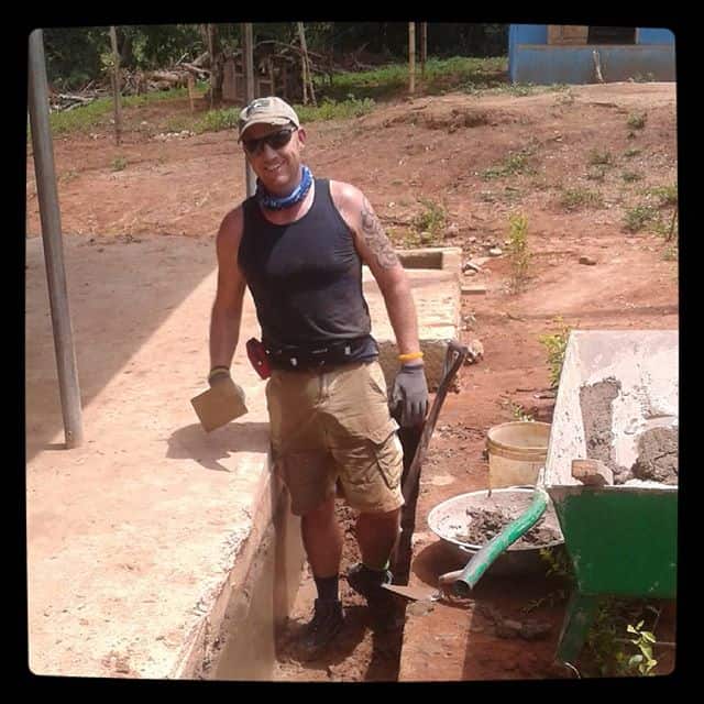 Chris is happily doing his first plastering in Africa – Ghana. #villagebyvillage #Ghana #abenta #building #volunteer