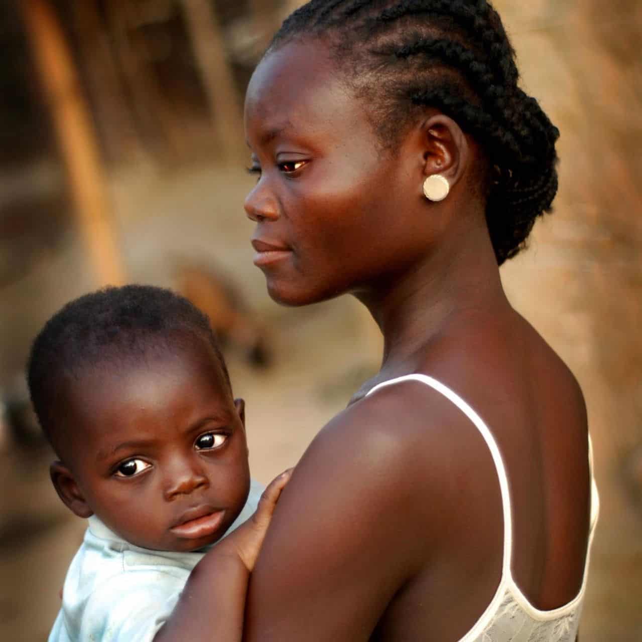 health volunteers in Africa support this mother and her child
